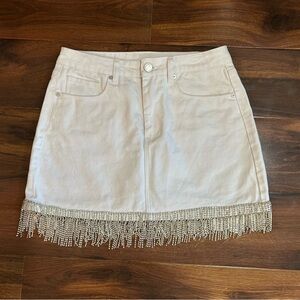 White denim mini skirt with silver fringe